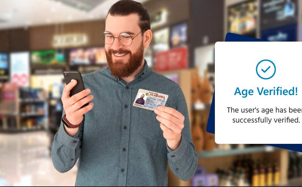 Smiling man holds his phone. Age verification successful screen partly visible on the right edge.