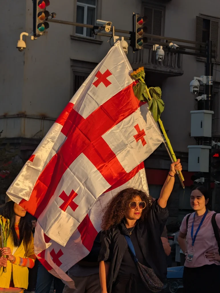 Protester waving Georgian flag